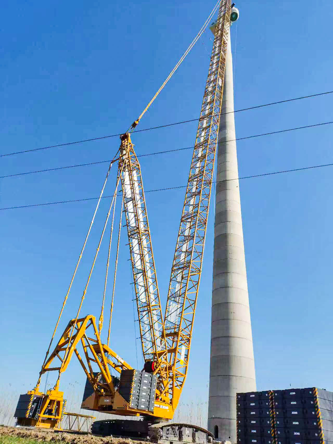 160米高空精准“搭积木”：九游娱乐XLC15000M分体吊装6.25兆瓦风机全纪录